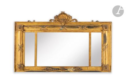 null A giltwood mirror of rectangular shape, decorated with shells and rosettes;...