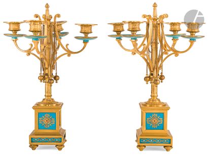 null Mantelpiece comprising a clock and two four-light candelabras, decorated with...