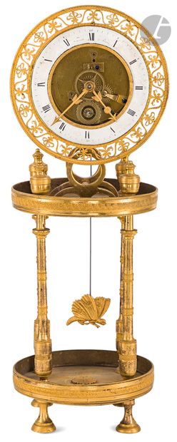 null A gilt bronze and cut brass clock with skeleton movement, the dial with Roman...