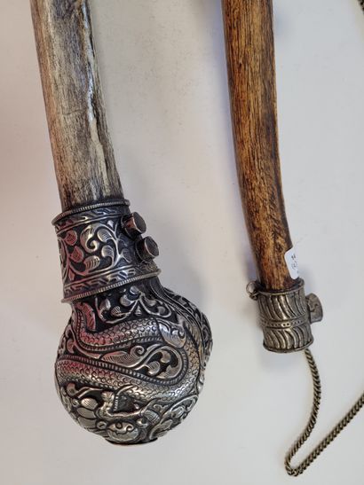 null Two ritual trumpets (Rkang gling or kangling), Tibetan
mounted bone, head of...