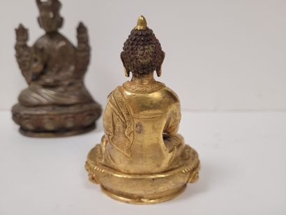 null Two bronze statuettes, Asia, 20th
centuryOne gilded representing Buddha, hands...