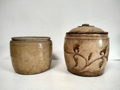 null Two jars, one covered in beige stoneware, one with incised foliage decoration,...
