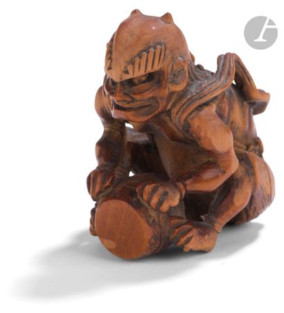 null Wooden netsuke representing an oni with a drum, Japan, 19th centuryHe
is sitting...