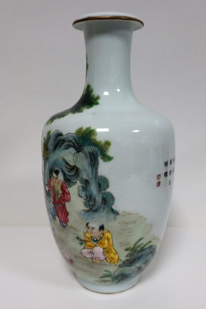 null A baluster-shaped porcelain vase enamelled in the famille rose style, China,...