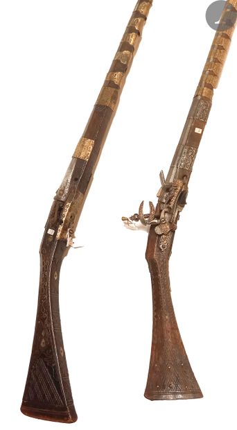 null Two Moukalah flintlock rifles. 
- One with iron and brass ring. Miquelet style...