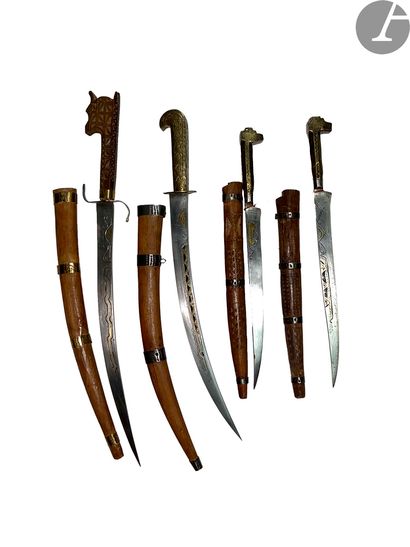 null Set of four North African daggers type Flissah. 
Wooden and brass handles with...