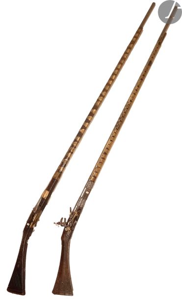 null Two Moukalah flintlock rifles. 
- One with iron and brass ring. Miquelet style...