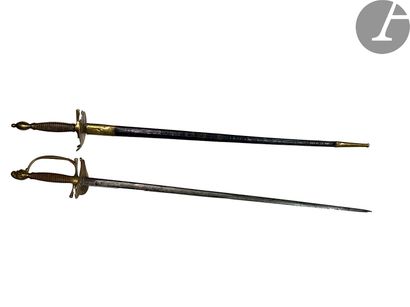 Two uniform swords: - Pommel with a helmet,...