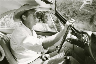 null William Claxton (1927-2008
)Steve McQueen driving his car, 1964. 
Silver print...
