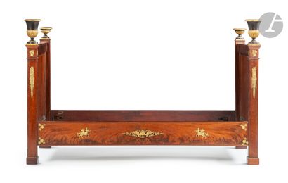 A molded mahogany side bed, patinated and...
