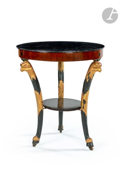 null Circular table in walnut wood patinated and gilded, the black top of Belgium...