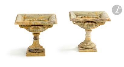  A pair of marble vases carved after the antique, the square bowl resting on a fluted...