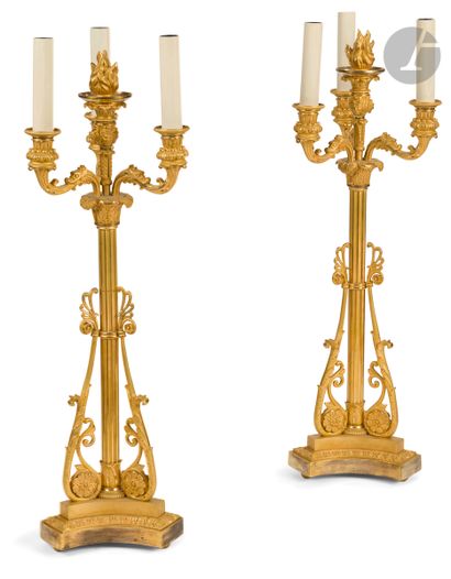 A pair of ormolu candelabras with four lights...