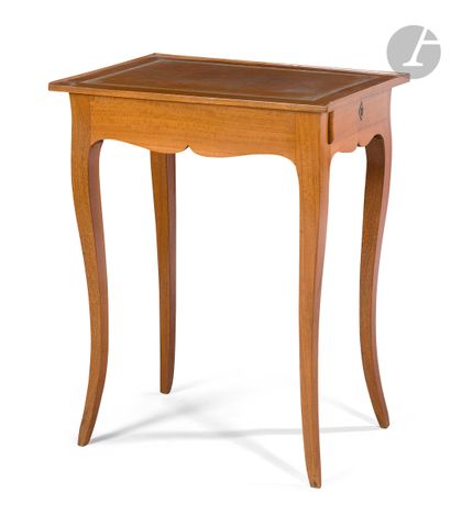  Mahogany writing table, the scalloped front opening to a drawer and resting on cambered...