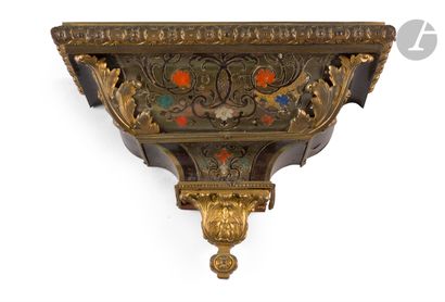  A small console in brown tortoiseshell, stained horn and mother-of-pearl marquetry...