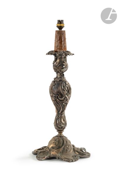  Important silvered bronze torch with rocaille decoration of foliage and clasps in...