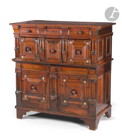 null A moulded and stained oak sideboard opening to two drawers and two leaves, the...