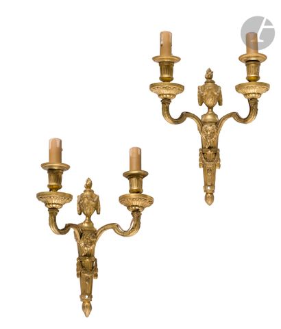 A pair of gilt bronze two-armed lights decorated...