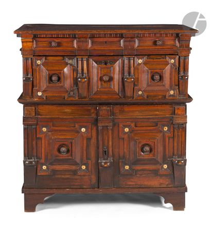 null A moulded and stained oak sideboard opening to two drawers and two leaves, the...