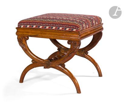A stained wood stool with a frame and foliage...