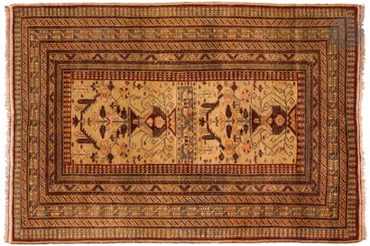 Belouch. Carpet with ivory background surrounded...