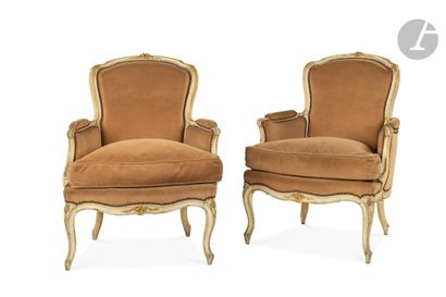 null A pair of moulded, carved, painted and gilded beechwood bergères with cabriolet...