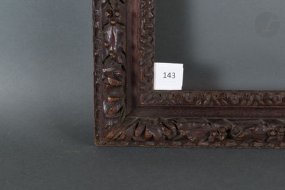 null Carved and stained oak frame decorated with laurel bundles.
Louis XIII period...