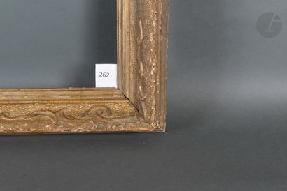 null Carved wood and gilded stucco frame with scrolls on a bulinato background.
Venice,...
