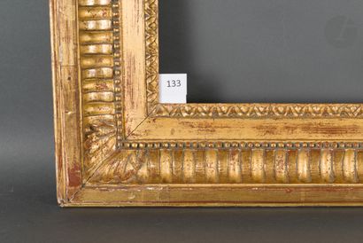 null 
Carved and gilded oak frame decorated with canals, acanthus leaves in the corners...
