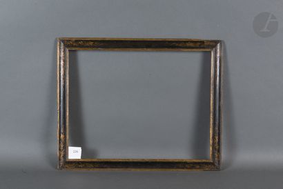 null Frame with reversed profile in black and gold molded wood decorated in the corners...