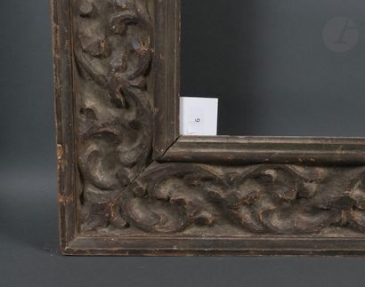 null *Carved and painted wood frame decorated with foliage and head of fauna.circa...