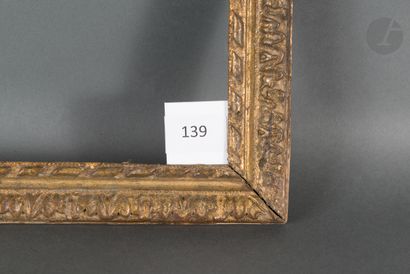 null 
Carved and gilded oak frame decorated with acanthus leaves and ribbons.

Louis...
