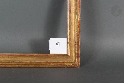 null Baguette en bois mouluré et doré.
Époque Louis XVI (accidents).
28,4 x 30,8 cm...