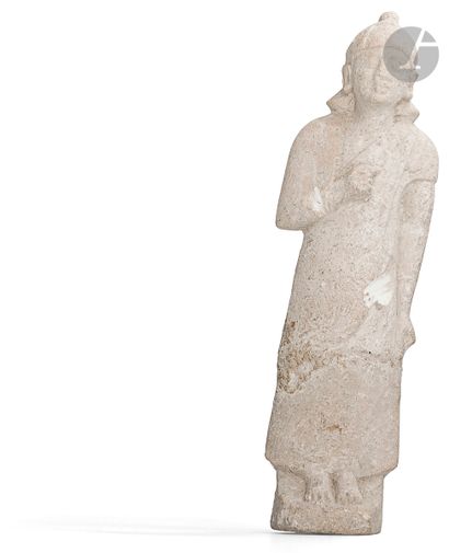null Votive statuette depicting a standing male figure, wearing a conical cap with...