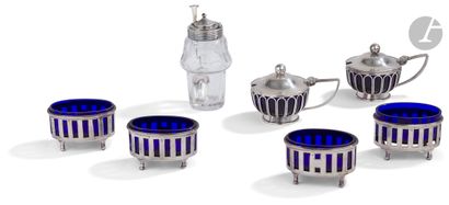 null Silver condiment set composed of four quadripod saltcellars and their blue glasses...