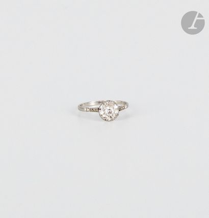  Platinum ring, paved with old-cut diamonds, the shoulder set with rose-cut diamonds....