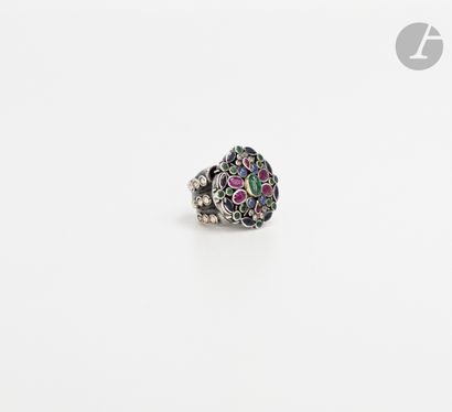  Silver ring, set with a cabochon emerald surrounded by rubies, sapphires, rose-cut...