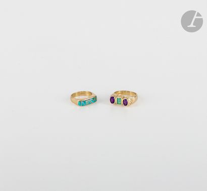 null 
Suite of two 
14K (585) gold rings, one with enamel decoration, the other set...
