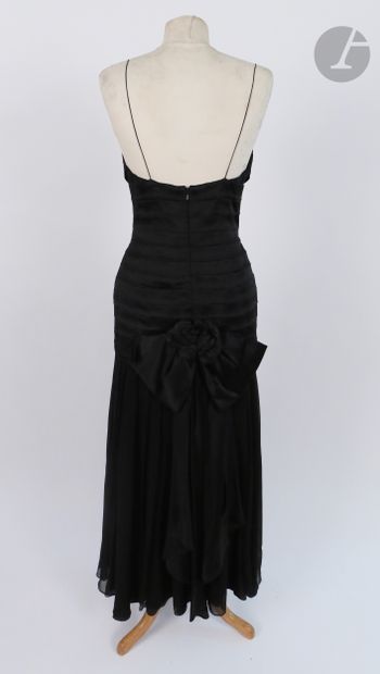null Anonymous. 

Black pleated satin and chiffon long dress, flower in the back,...