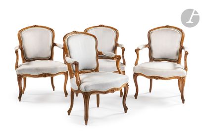 null Suite of four armchairs in molded and carved wood, with foliage and flowers...