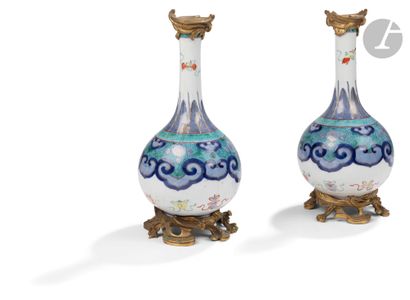 null China
Pair of bottle-shaped porcelain vases with polychrome decoration of flowers...