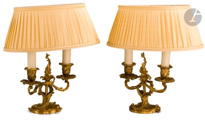 null Pair of small ormolu candelabras with two arms of light, scrolls and foliage;...