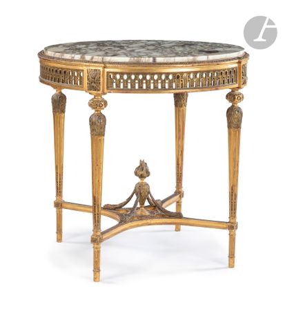 null Circular table in gilded wood, the top of purple breccia marble resting on an...