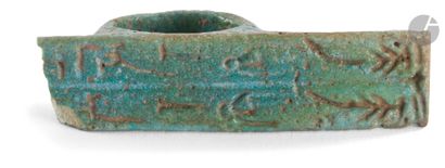 null Ring decorated with an inscription on a large bezel 
Egypt, Late Period.
Earthenware.
Length...