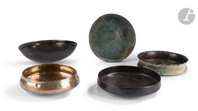 null Five bowls, one with rosette decoration 
Iran, 7th-4th century B
.C. 

Bronze...