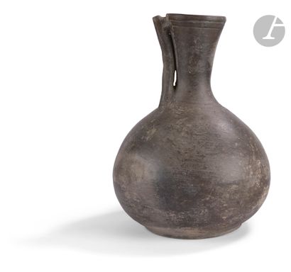 null Vase with tubular neckIran
, 1st millennium B
.C.

Terracotta. 
Height : 26...