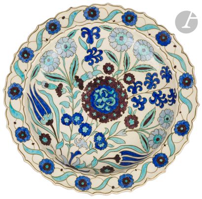 null Edmond LACHENAL (1850-1930
) Hollow dish with a painted palette dominated by...