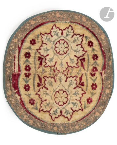  Velvet with floral decoration, Ottoman Turkey, 17th centuryTwo semicircular fragments...