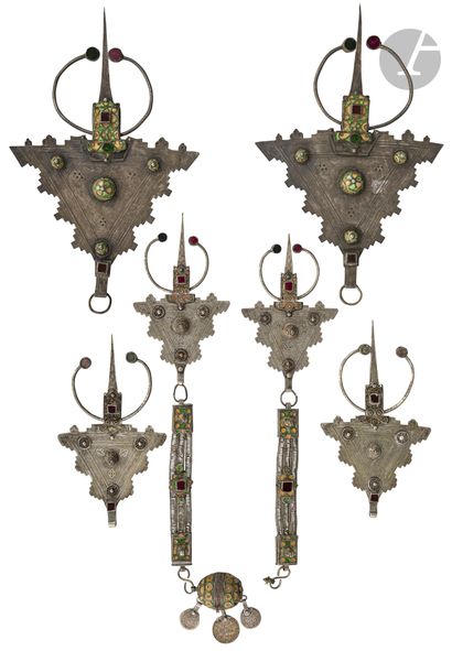 A pectoral set and two pairs of silver fibulae,...