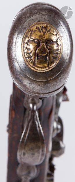 null Long flintlock pommel gun.

Round barrel with beading at the muzzle and flat...